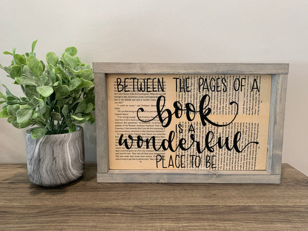 Between The Pages Of A Book Is A Wonderful Place To Be - Reclaimed Book Pages Sign